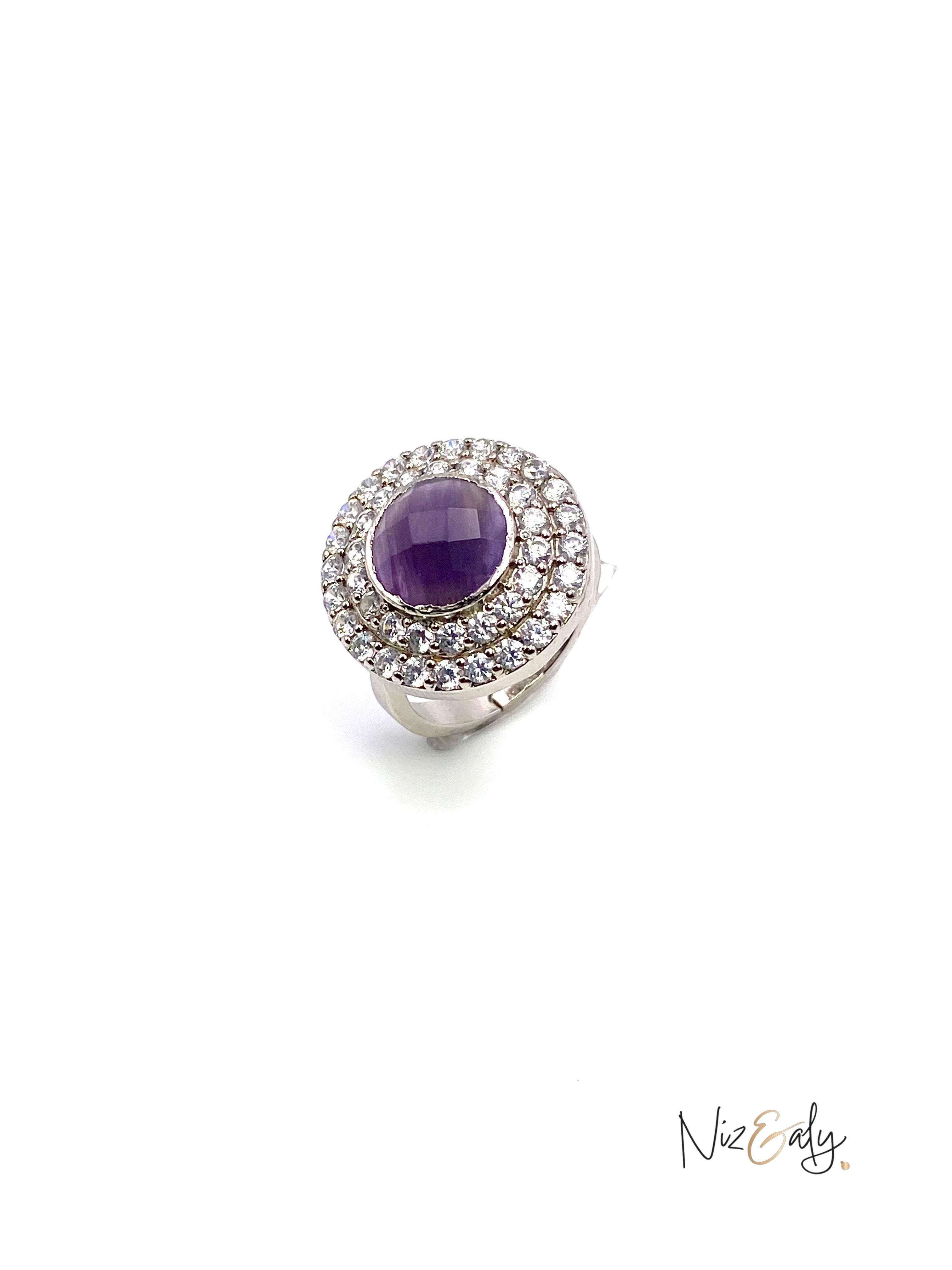 Niz & Aly amethyst hemisphere ring with a halo of sparkling white stones set in a polished silver band.
